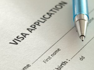 VIsa application form with pen,closeup,for immigration,travel,social issues themes